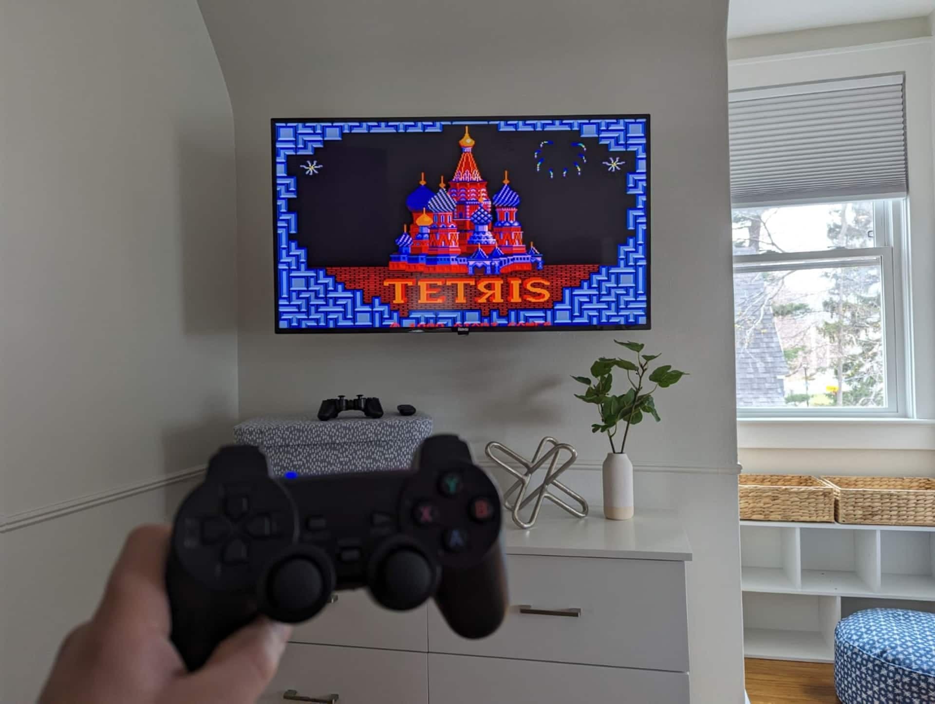 Game console set up on the TV in the bunk room