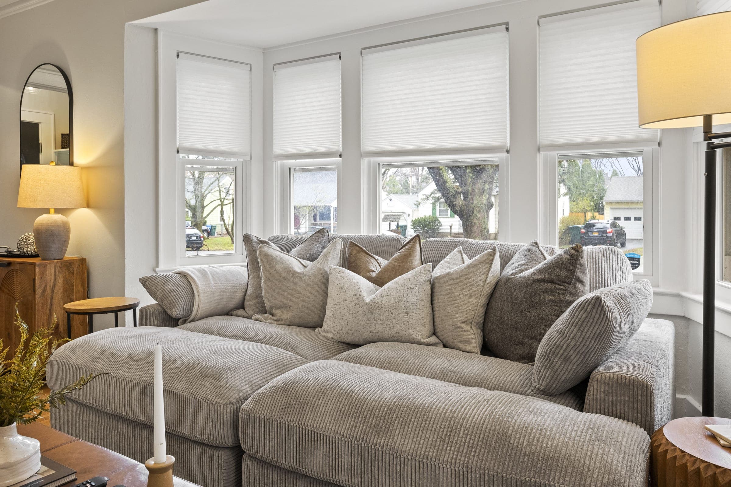Sectional sofa in front of a wall of bay windows